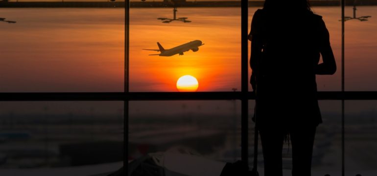 Silhouette of female waiting at the airport